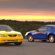 A photo of two MKIV Ford Mustang muscle cars.